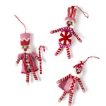 three madcap cottage Christmas felt nutcracker ornaments in red and white striped outfit on a white background