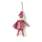 a madcap cottage Christmas felt nutcracker ornament in red and white striped outfit on a white background