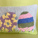 close up of a Purple easter pillow with four easter eggs.