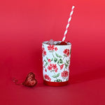 a white glass painted with geranium motifs called cottage grove from madcap cottage