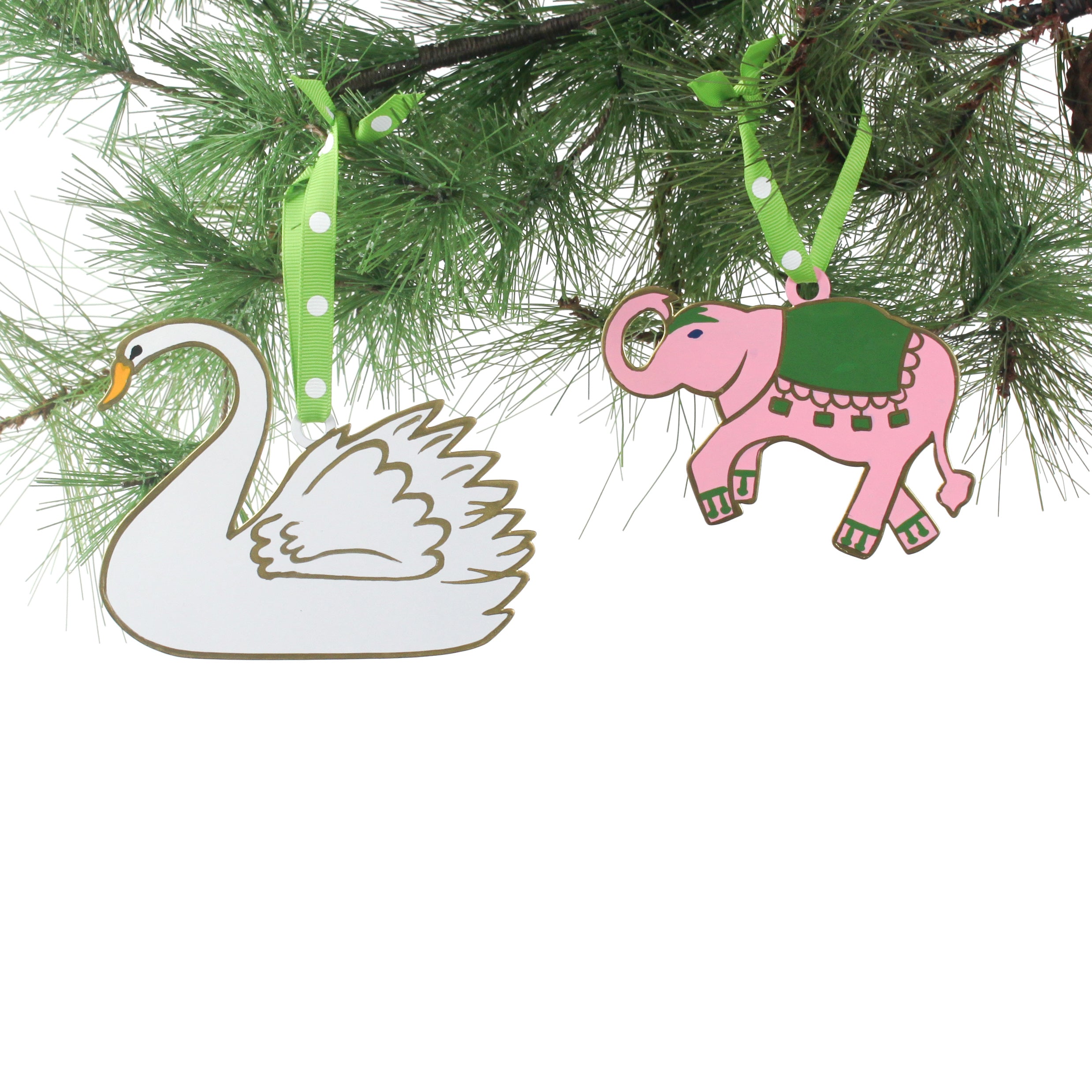 Decorative swan and elephant ornaments on a tree branch