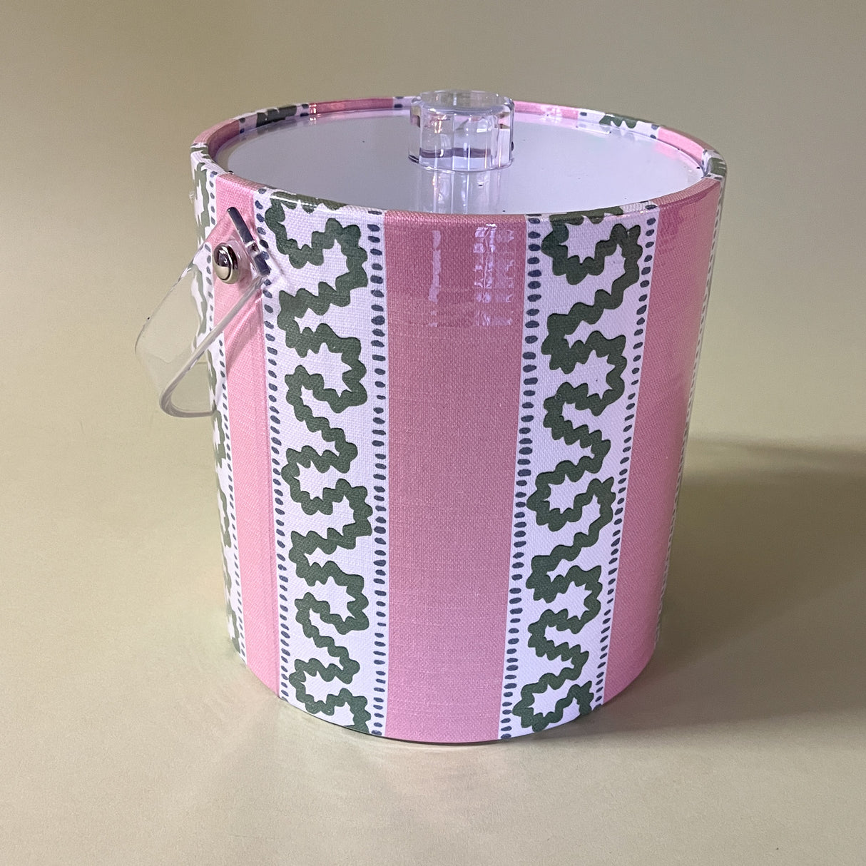 Agreen and pink striped ice bucket in madcap cottage's Harbor Trail Bahama Pink pattern.