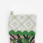 A palm leaf print pink and green Christmas stocking.
