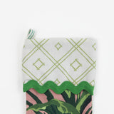 A palm leaf print pink and green Christmas stocking.
