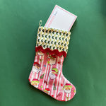 Red and green chinoiserie Christmas stocking with a  pagoda design on a green background