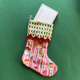 Red and green chinoiserie Christmas stocking with a  pagoda design on a green background