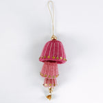 decorative felt christmas ornaments in pink with gold sequin details on a white background