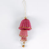 decorative felt christmas ornaments in pink with gold sequin details on a white background