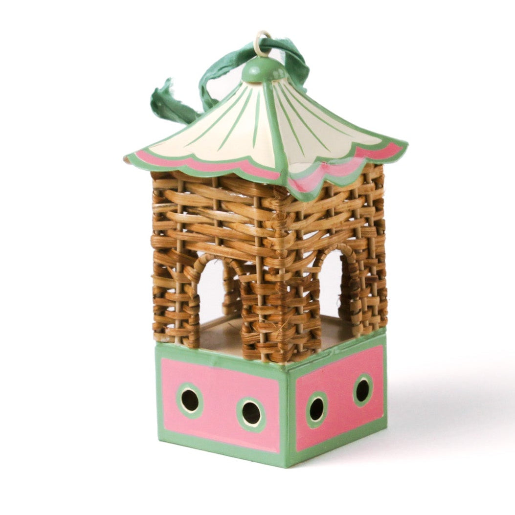 two miniature rattan pagoda chinoiserie christmas ornaments with green and pink painted accents from the brand madcap cottage on a white background. 