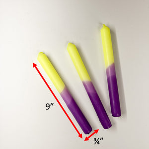 Three taper candles with a purple and yellow gradient, dimensions are 9" by 3/4"