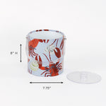 dimension of a Rock Lobster red and blue ice bucket filled with ice and champagne features a green shell and red lobster print