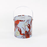 Rock Lobster red and blue ice bucket filled with ice and champagne features a green shell and red lobster print