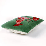 Pillow with a red lobster design on a green background from the madcap cottage designers. 