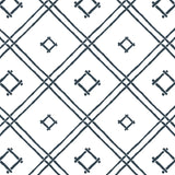 A navy bamboo trellis wallpaper design on a white background from Madcap Cottage. 