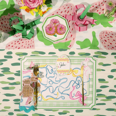 an easter placemat featuring a blue ribbon and easter bunny design gliding across a colorful easter tablescape