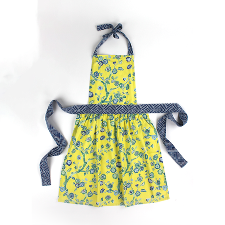 Madcap cottage apron in Yellow color with blue floral pattern on a white background