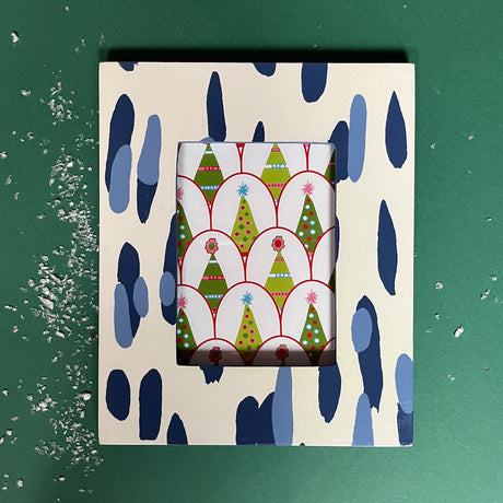 a blue and white photo from featuring a brushtroke motif