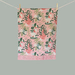 chinoiserie Tea towel with pink background, white pug, and pink vase.