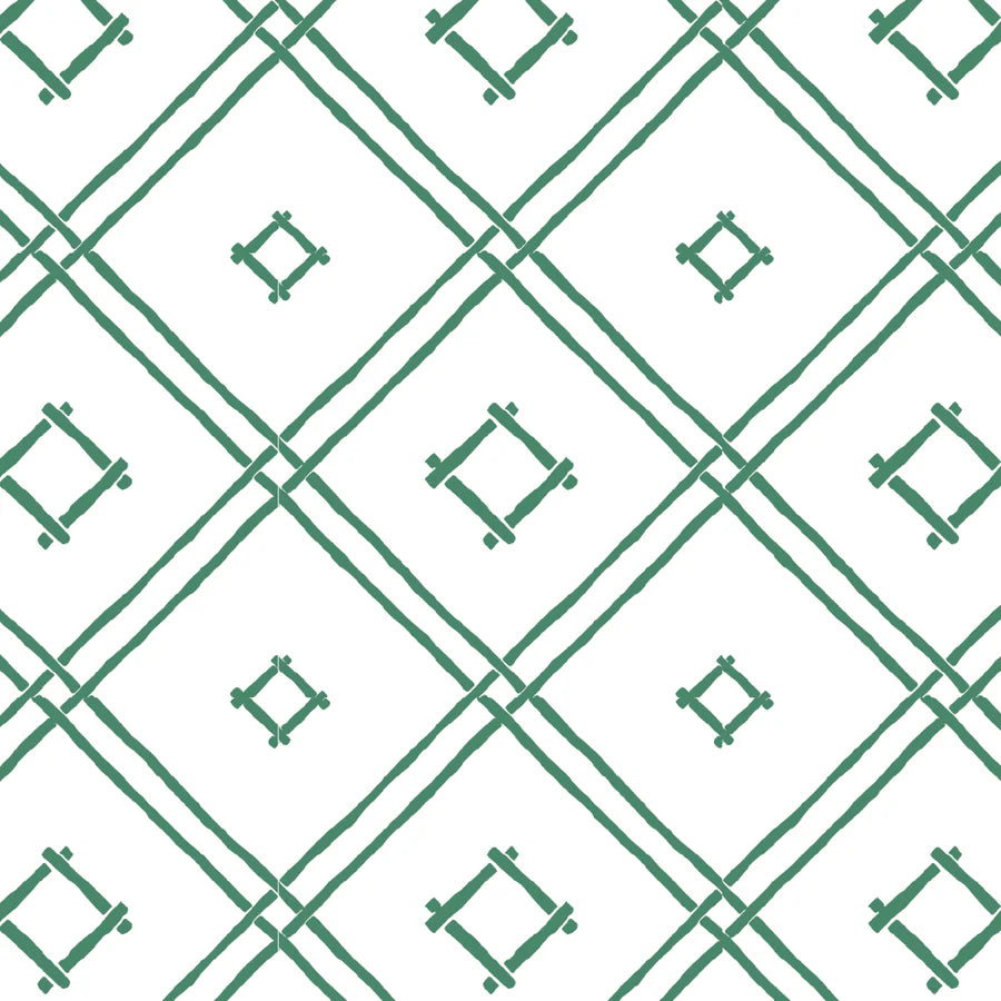 A green bamboo trellis wallpaper design on a white background from Madcap Cottage. 