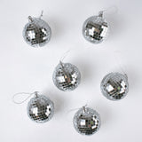 six silver disco ball christmas ornaments on a white background