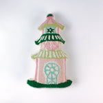 Decorative pillow shaped like a pagoda, featuring a pink base with green and white tiered roofs and intricate embroidered details in soft pastel colors.
