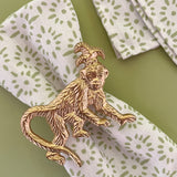 light green and white dinner napkin with monkey dinner napkin ring
