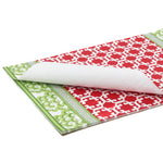green and red paper placemats in a trellis pattern called "Monserrat" by Madcap Cottage in a white background