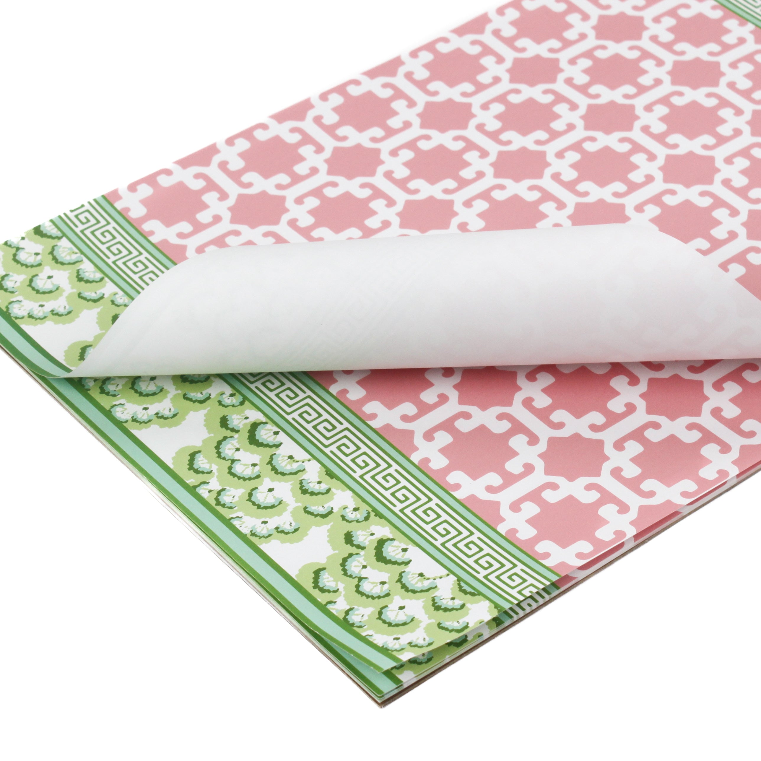 pink and green paper placemats in a trellis pattern called "Monserrat" by Madcap Cottage with white background.