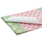 pink and green paper placemats in a trellis pattern called "Monserrat" by Madcap Cottage with white background
