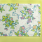 a springtime strawberry print fabric easter table runners in multicolors.