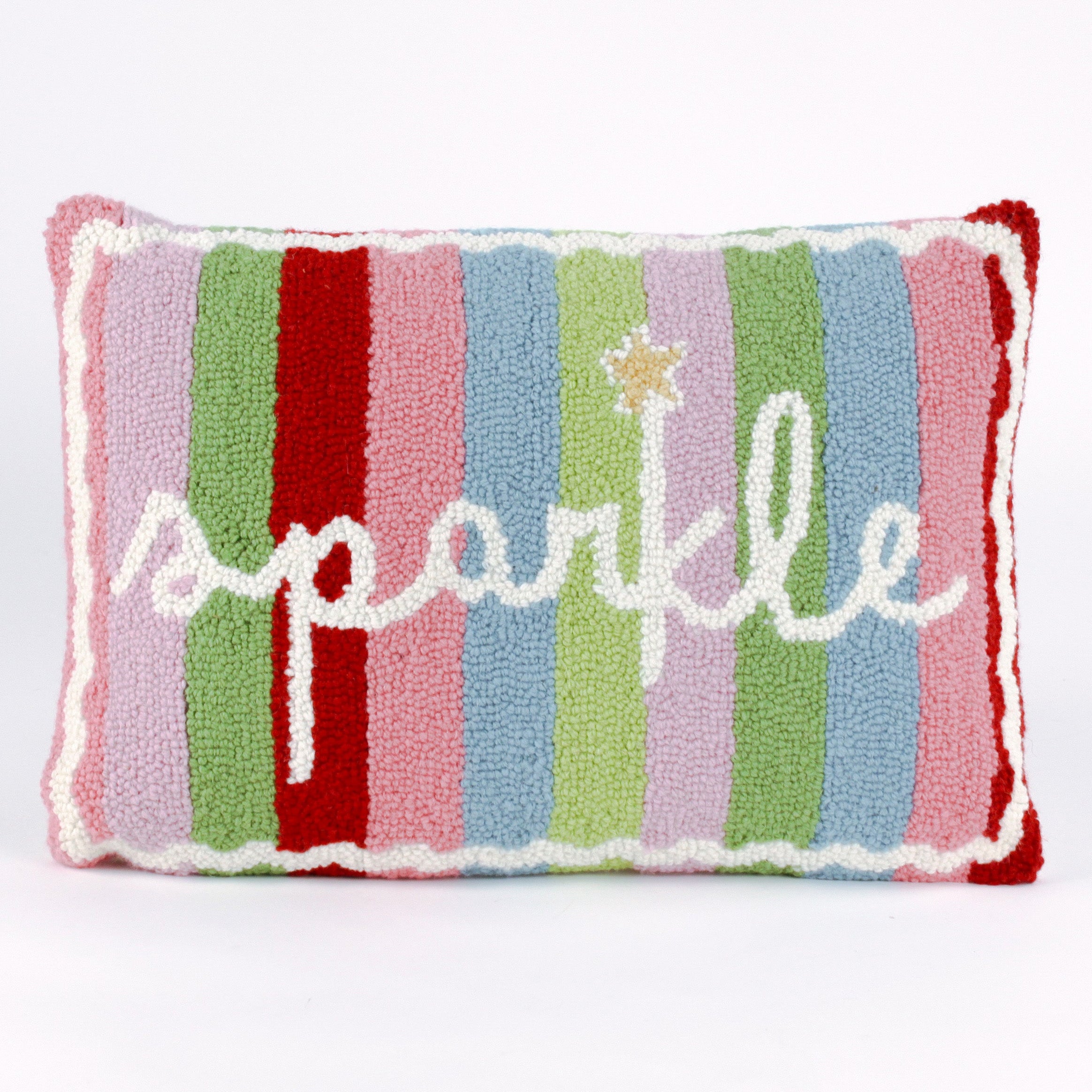 Rectangular colorful pillow with  vertical stripes in red, pink, green, blue, and lavender, featuring the word “sparkle” written in white cursive with a small gold star above the letter “k.”