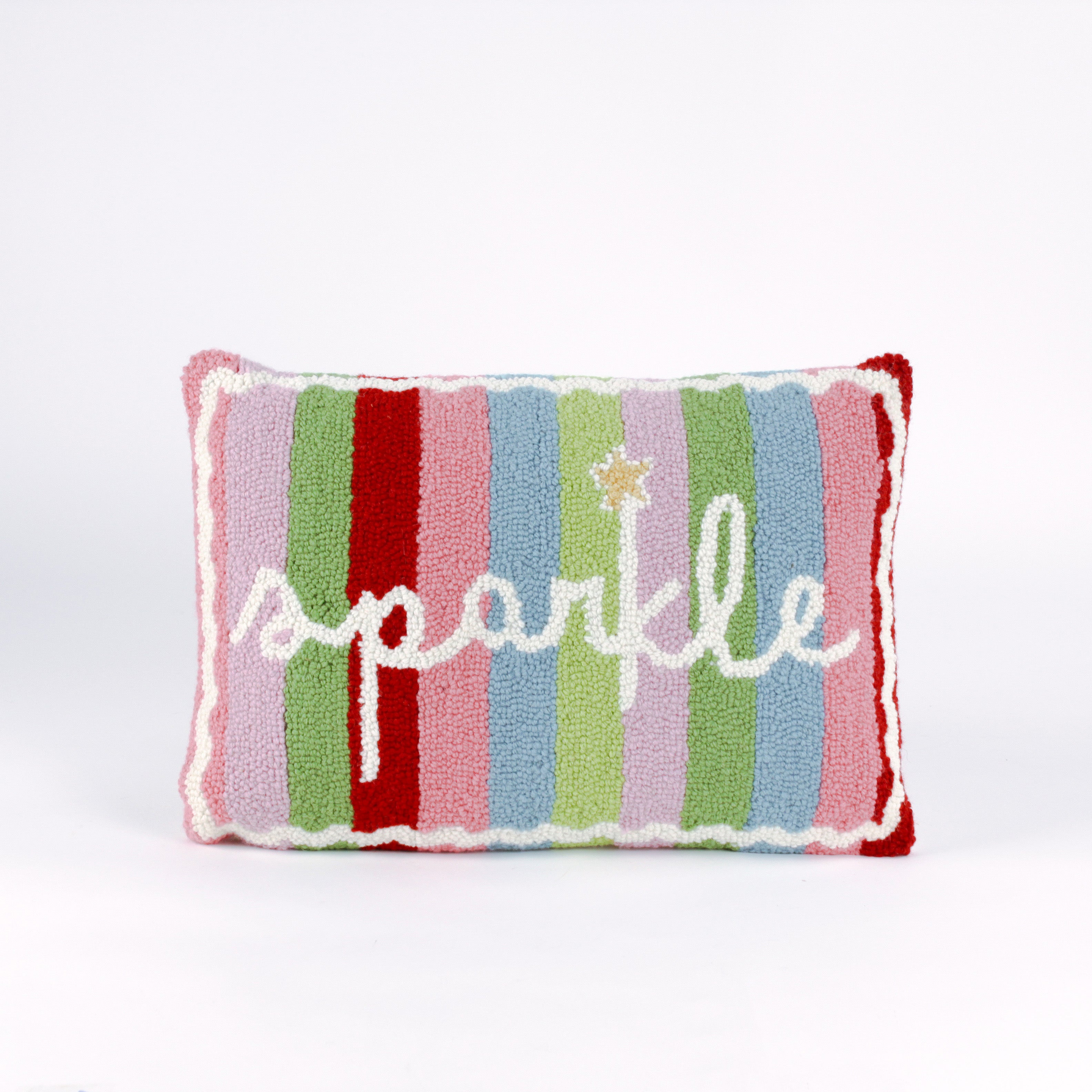 Rectangular colorful pillow with  vertical stripes in red, pink, green, blue, and lavender, featuring the word “sparkle” written in white cursive with a small gold star above the letter “k.”