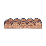 side view of scalloped rattan tray with navy trim