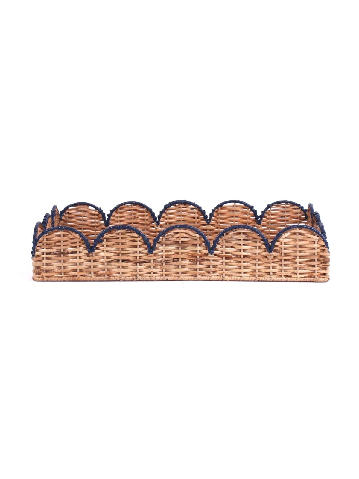 side view of scalloped rattan tray with navy trim