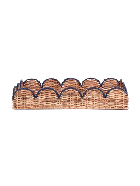 side view of scalloped rattan tray with navy trim