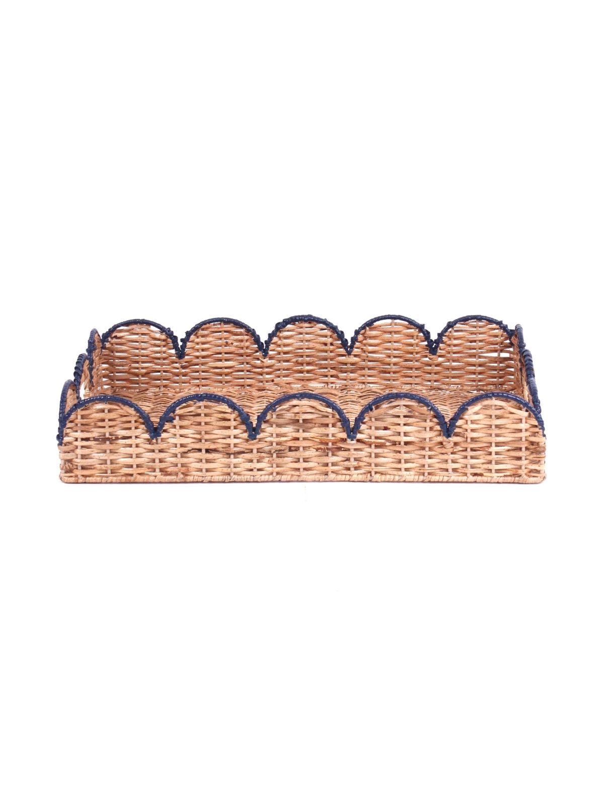 side view of a scalloped rattan tray with navy blue trim
