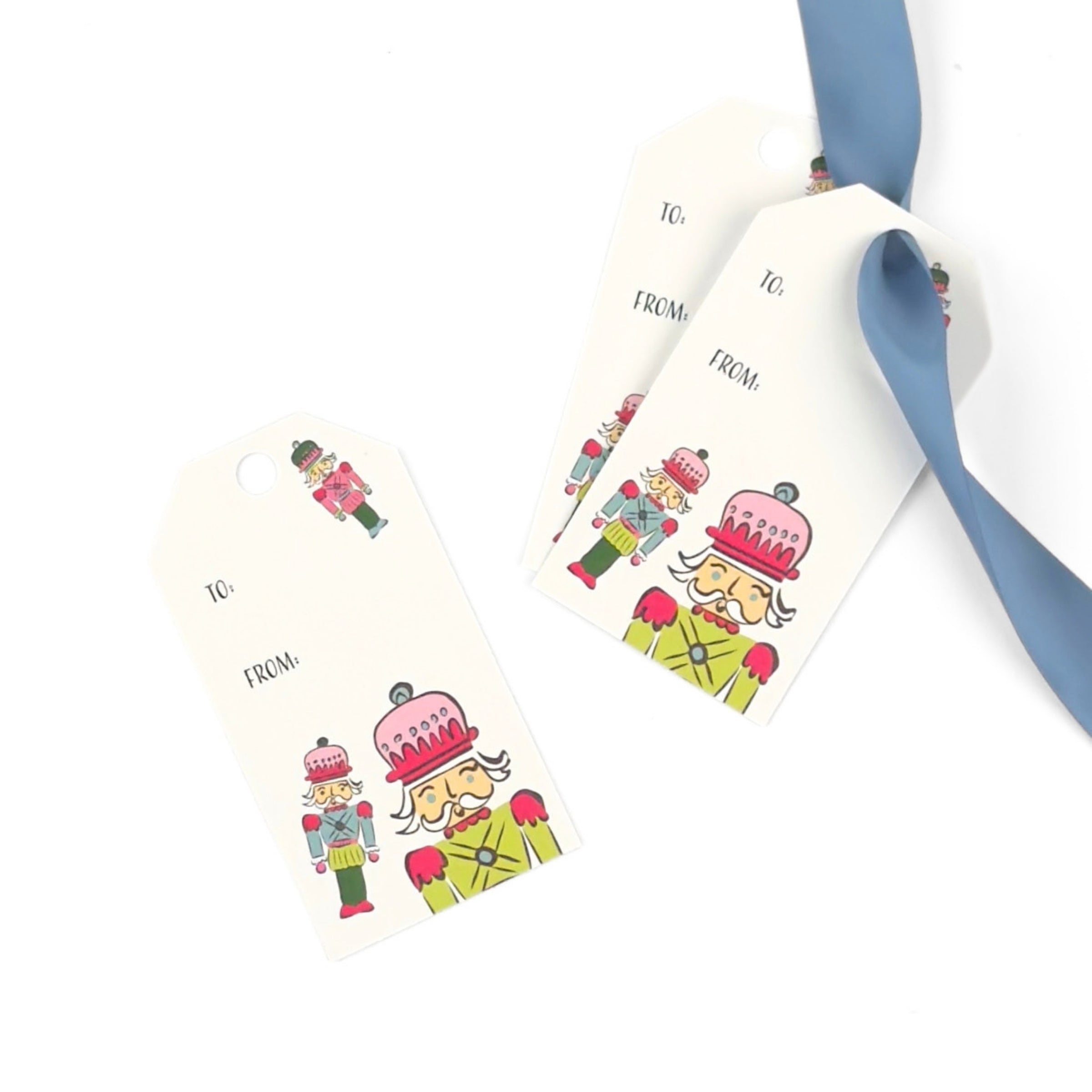 Festive Christmas gift tags featuring colorful nutcracker soldiers, playful holiday illustrations, and personalized gifting fields.
