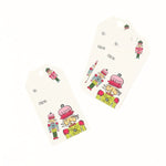 Festive Christmas gift tags featuring colorful nutcracker soldiers, playful holiday illustrations, and personalized gifting fields.