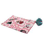 a pink christmas tea towel with nutcracker ballet motifs of swans, ribbons, christmas trees, ballerinas and nutcrackers against a white background. 