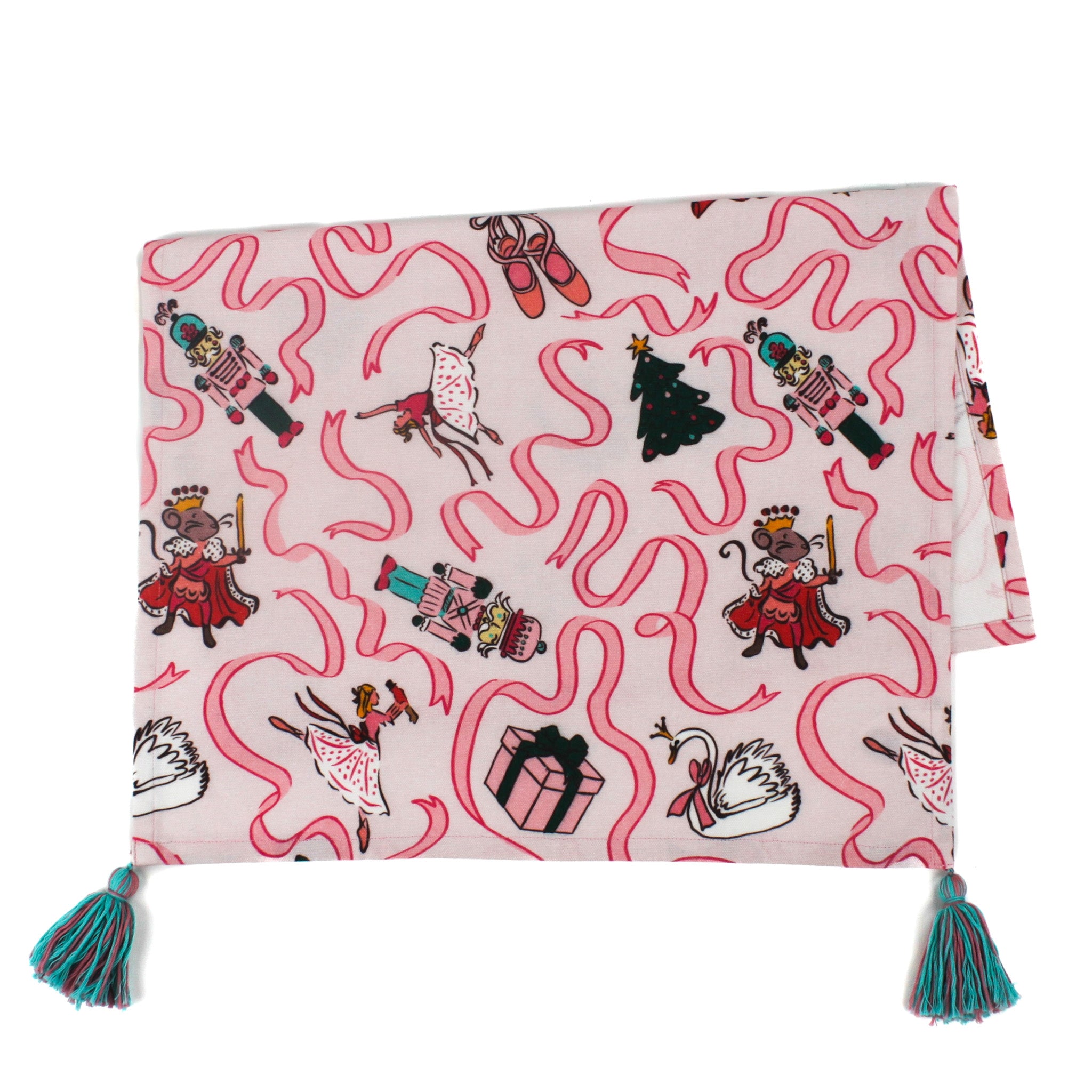 a pink christmas tea towel with nutcracker ballet motifs of swans, ribbons, christmas trees, ballerinas and nutcrackers against a white background. 