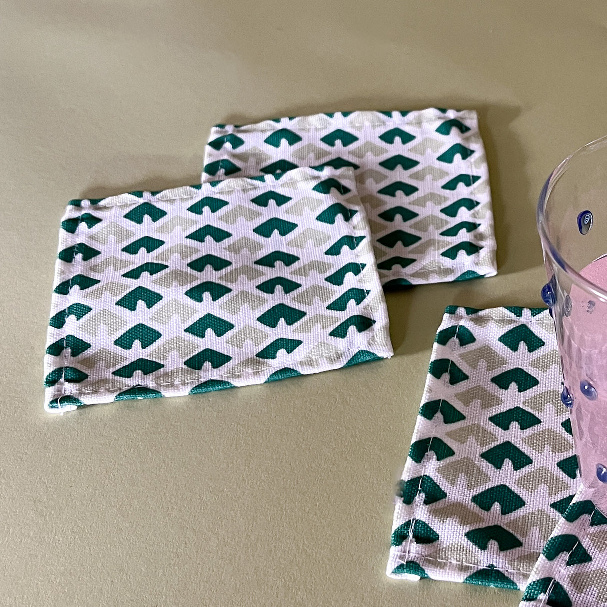 up close old jaipur green white cloth cocktail napkins