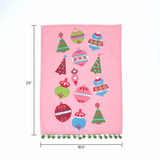 Pink christmas tea towel with colorful ornament designs on a white background with dimension markers for 24" x 18"