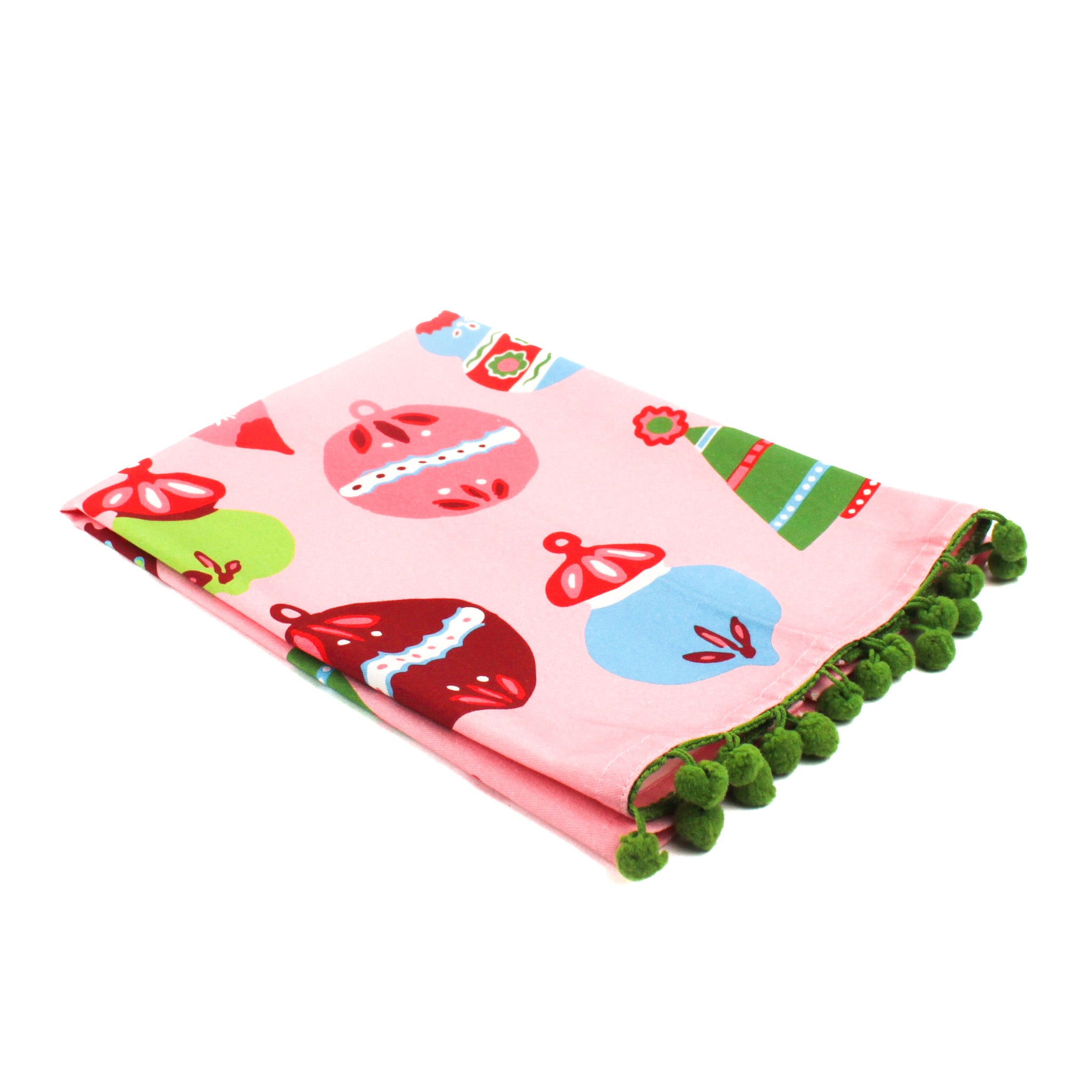 Pink christmas tea towel with colorful ornament designs on a white background