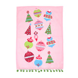 Pink christmas tea towel with colorful ornament designs on a white background