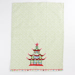 Christmas Pagoda Tea Towel with some embroidery on green and white background