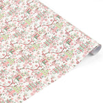 Elegant chinoiserie gift wrap roll featuring whimsical pagodas, delicate pink florals, and charming botanical patterns.