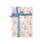 Elegant chinoiserie gift wrap featuring whimsical pagodas, delicate pink florals, and charming botanical patterns throughout.