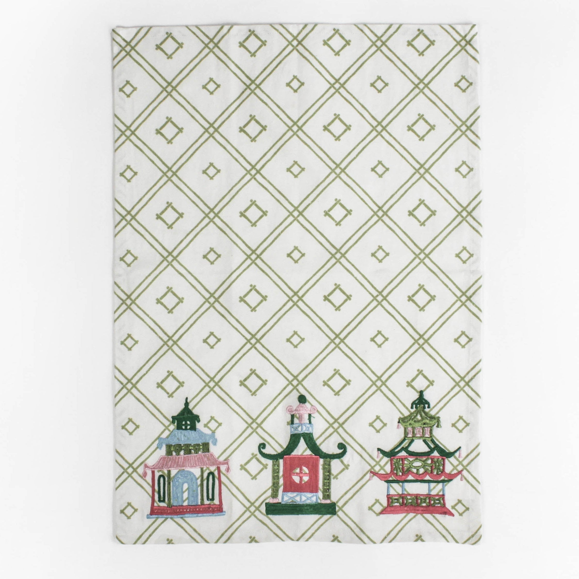 a green and white chinoiserie tea towel with three embroidered pagoda motifs. 