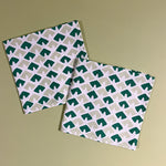 white and green napkins featuring a triangular block print motif called "Old Jaipur" from Madcap cottage. 