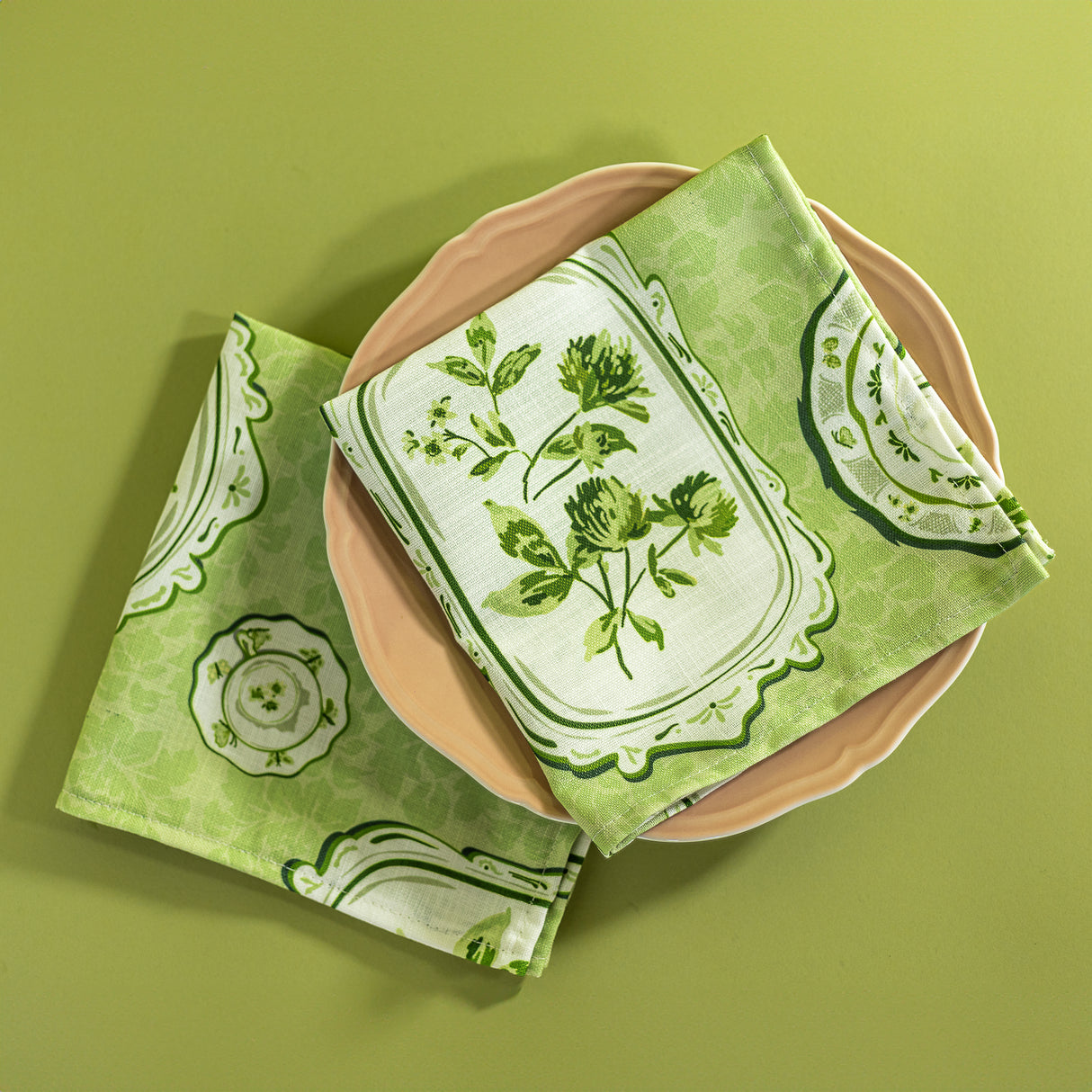 A pair of green napkins made from vintage  plates fabric